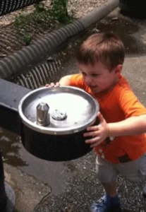 boy and water fountain