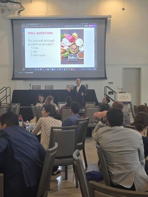 Tony running a live audience poll on daily protein intake