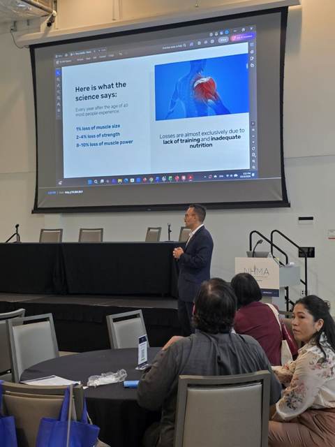 Tony presenting research on muscle loss after 40 to physicians